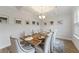 Bright dining room with a modern chandelier and large windows creating a welcoming ambiance for meals at 1017 Saltwater Cir, Johns Island, SC 29455