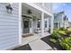 Inviting front porch with stylish decor and ample seating at 1017 Saltwater Cir, Johns Island, SC 29455