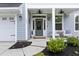 Welcoming front porch with cozy seating and decorative accents at 1017 Saltwater Cir, Johns Island, SC 29455