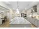 Bright, modern kitchen with a large island featuring bar seating, stainless appliances, and recessed lighting at 1017 Saltwater Cir, Johns Island, SC 29455
