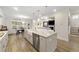 Open kitchen with an island, stainless steel appliances, and a dining area at 1017 Saltwater Cir, Johns Island, SC 29455