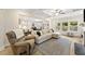 Open living area with coffered ceilings, hardwood floors, and seamless transitions into the modern kitchen at 1017 Saltwater Cir, Johns Island, SC 29455