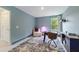 Charming home office with a patterned rug, desk, and window bringing in natural light at 1017 Saltwater Cir, Johns Island, SC 29455