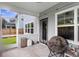 Cozy screened porch with seating, perfect for relaxing and enjoying the outdoors at 1017 Saltwater Cir, Johns Island, SC 29455
