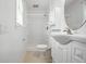 All white bathroom with tiled shower, white vanity, and toilet at 102 Berkshire Ct, Goose Creek, SC 29445
