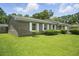 Charming brick home featuring a well-kept lawn, mature landscaping, and a welcoming curb appeal at 102 Berkshire Ct, Goose Creek, SC 29445