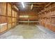 The garage features a workbench, shelving, concrete floor, and exposed ceiling beams at 102 Berkshire Ct, Goose Creek, SC 29445