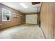 The garage features wood paneling, storage shelves and a steel garage door at 102 Berkshire Ct, Goose Creek, SC 29445