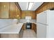 Traditional kitchen with wood cabinets and white appliances at 102 Berkshire Ct, Goose Creek, SC 29445