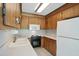 Traditional kitchen with white countertops, wooden cabinets, and essential appliances for cooking needs at 102 Berkshire Ct, Goose Creek, SC 29445