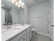 Bright bathroom features double sinks, granite countertops and tile flooring at 122 Royal Cainhoy Way, Huger, SC 29450