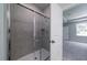Bathroom featuring a tiled shower with a glass door at 122 Royal Cainhoy Way, Huger, SC 29450