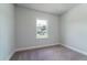 Cozy bedroom with neutral carpet, white trim, and plenty of natural light at 122 Royal Cainhoy Way, Huger, SC 29450
