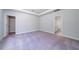 Spacious bedroom with neutral paint, carpeted floor, and walk-in closet entrance at 122 Royal Cainhoy Way, Huger, SC 29450