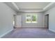 Carpeted bedroom features a large window and white trim at 122 Royal Cainhoy Way, Huger, SC 29450