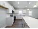 Modern kitchen with white cabinets, stainless steel appliances, and a large island at 122 Royal Cainhoy Way, Huger, SC 29450