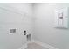 Clean laundry room with tile flooring and space for washer and dryer at 122 Royal Cainhoy Way, Huger, SC 29450