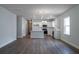 Open-concept living space featuring wood-look flooring and plenty of natural light at 122 Royal Cainhoy Way, Huger, SC 29450