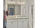 Bright bathroom featuring double sink vanity, granite countertops, and glass shower door at 123 Oyama Rd, Summerville, SC 29486