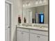 Bright bathroom featuring double sink vanity, granite countertops, and modern fixtures at 123 Oyama Rd, Summerville, SC 29486