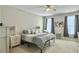 Bright bedroom features a ceiling fan, two windows, and neutral colored decor at 123 Oyama Rd, Summerville, SC 29486