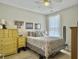 Comfortable bedroom with a queen-size bed, a bright window, and ample storage at 123 Oyama Rd, Summerville, SC 29486