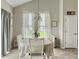 Cozy dining area with a floral centerpiece, great natural light, and modern decor at 123 Oyama Rd, Summerville, SC 29486