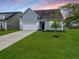 Charming single-Gathering home with a well-manicured lawn, attached garage, and beautiful landscaping, perfect for suburban living at 123 Oyama Rd, Summerville, SC 29486