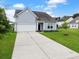Lovely single-Gathering home with a pristine lawn, attached two-car garage, and charming curb appeal in a desirable neighborhood at 123 Oyama Rd, Summerville, SC 29486