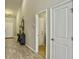 Well-lit hallway with modern flooring and neutral paint, leading to various rooms in the home at 123 Oyama Rd, Summerville, SC 29486