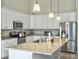 Modern kitchen with white cabinets, granite counters, stainless steel appliances, and a large island at 123 Oyama Rd, Summerville, SC 29486