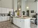 Bright kitchen with a granite island, stainless steel appliances, and light wood floors at 123 Oyama Rd, Summerville, SC 29486