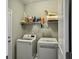 Functional laundry room with modern appliances, ample shelving, and practical layout, making chores efficient and organized at 123 Oyama Rd, Summerville, SC 29486