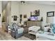 Spacious living room with high ceilings, comfortable seating, and a large entertainment center at 123 Oyama Rd, Summerville, SC 29486