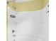 Clean white bathtub and shower combination with convenient shelving for toiletries at 127 Rawlins Dr, Summerville, SC 29485