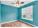 Serene bedroom featuring wood floors, a ceiling fan, and a bright window, creating a relaxing and inviting atmosphere at 127 Rawlins Dr, Summerville, SC 29485