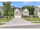 A lovely two-story home with a spacious driveway and lush green lawn, perfect for families at 127 Rawlins Dr, Summerville, SC 29485