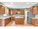Well-lit kitchen featuring stainless steel appliances, a center island, and gorgeous wood cabinets at 127 Rawlins Dr, Summerville, SC 29485
