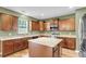 Spacious kitchen with stainless appliances, granite counters, ample cabinets, and a center island at 127 Rawlins Dr, Summerville, SC 29485