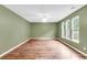 Bright living room featuring light-colored wood flooring and large windows, flooding the space with natural light at 127 Rawlins Dr, Summerville, SC 29485