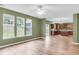 Open-concept living room flows seamlessly into the kitchen, featuring hardwood floors and abundant natural light at 127 Rawlins Dr, Summerville, SC 29485