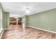 Open-concept living area featuring hardwood floors and a kitchen with an island, ideal for modern living and entertaining at 127 Rawlins Dr, Summerville, SC 29485