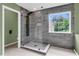 Step into this spa-like shower with a glass enclosure and rain shower head at 127 Rawlins Dr, Summerville, SC 29485