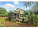 Screened-in porch and natural setting enhance the charm of this backyard at 1321 Wild Olive Dr, Mount Pleasant, SC 29464
