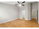 A bedroom featuring hardwood floors, with access to a walk-in closet and an additional room through separate doorways at 1321 Wild Olive Dr, Mount Pleasant, SC 29464