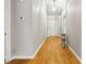 Inviting hallway with gleaming wood floors and neutral paint is awaiting your personal touch at 1321 Wild Olive Dr, Mount Pleasant, SC 29464