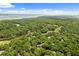 Aerial view of a lush, green neighborhood, with a golf course and water features, creating a serene landscape at 1326 Sea Elder Dr, Kiawah Island, SC 29455