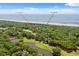 An aerial view of 1326 Sea Elder Ct, located in a golf community near the beach at 1326 Sea Elder Dr, Kiawah Island, SC 29455