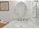 Bathroom featuring a marble countertop, oval mirror, and ample vanity storage at 1326 Sea Elder Dr, Kiawah Island, SC 29455