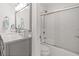 Modern bathroom featuring a sleek vanity with marble countertop and a shower-over-tub with sliding glass doors at 1326 Sea Elder Dr, Kiawah Island, SC 29455